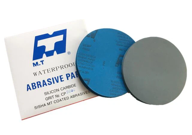 Adhesive backed sandpaper
